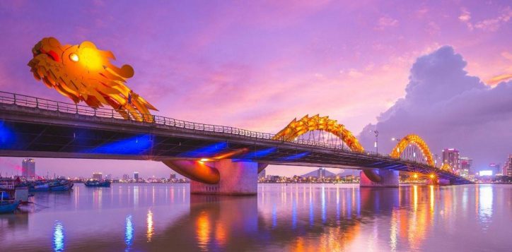 sunset-view-of-the-dragon-bridge-glowing-over-calm-water-2